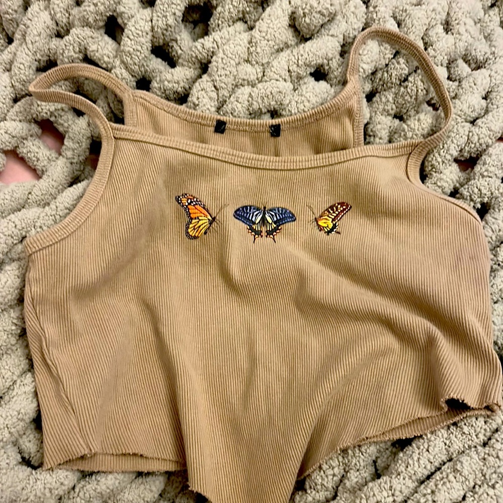 tan shirt with butterflys